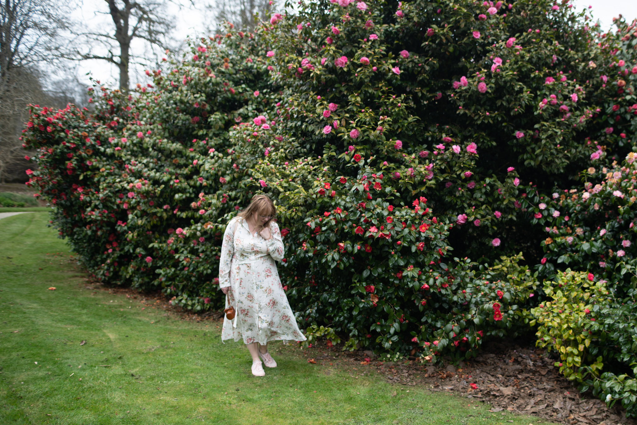 fashion blogger wearing a floral shirt dress