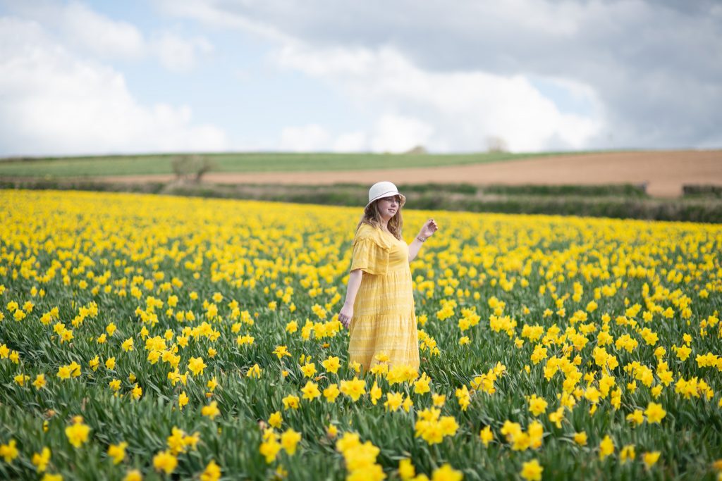 Over 30 style blogger wearing a yellow m&s dress